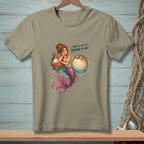 Mermaid and pufferfish with text "That's a lot of drama per inch."