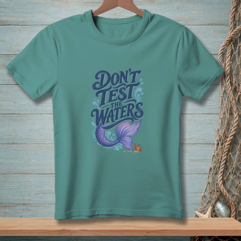 Teal t-shirt with "Don't Test the Waters" text, mermaid tail, and crab graphic.