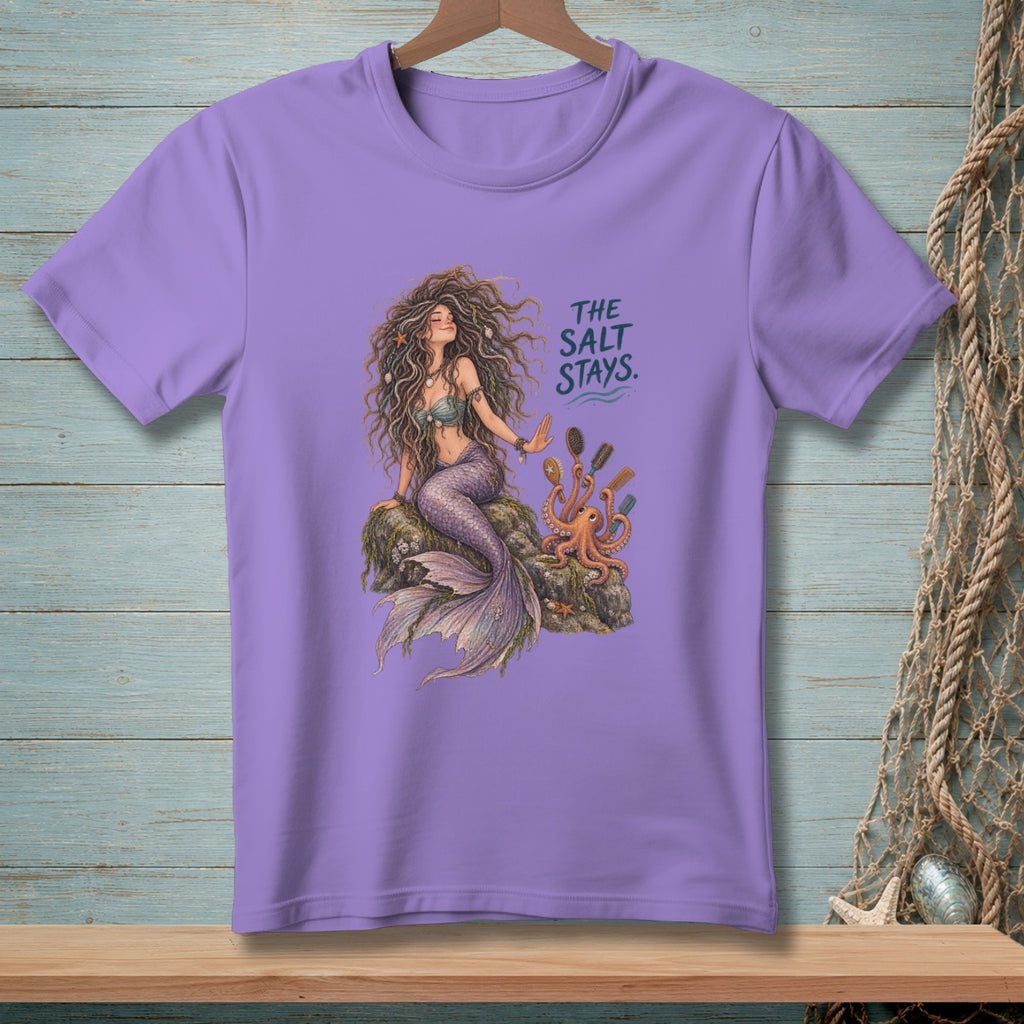 Purple t-shirt with mermaid, octopus, hairbrush, and text "THE SALT STAYS".
