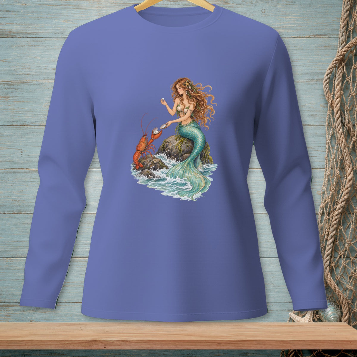 Long-sleeve shirt with mermaid and lobster on a rock with pearls.