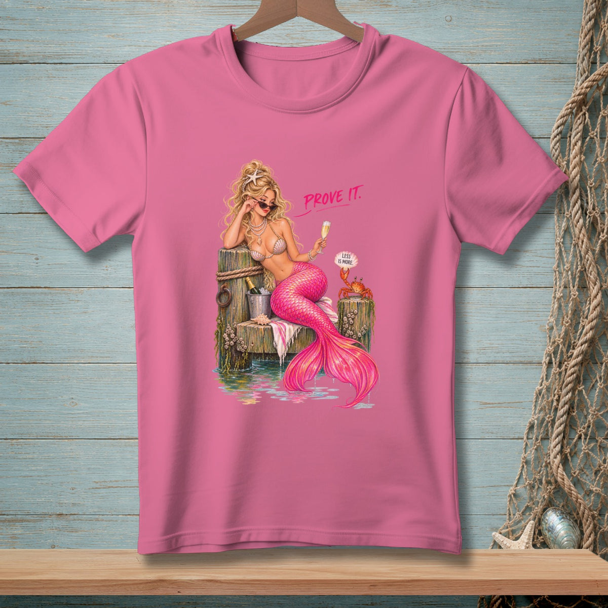 Pink t-shirt featuring a mermaid with a pink tail, holding a glass, and text "PROVE IT."