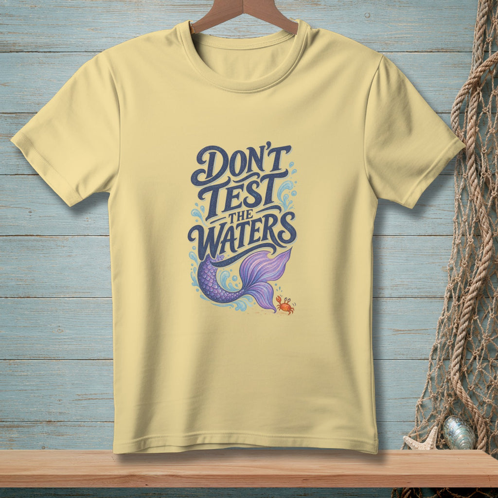 Yellow t-shirt with "Don't Test The Waters" and a mermaid tail and crab.