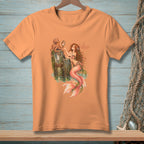Orange t-shirt featuring a mermaid and octopus with text "AS EXPECTED".
