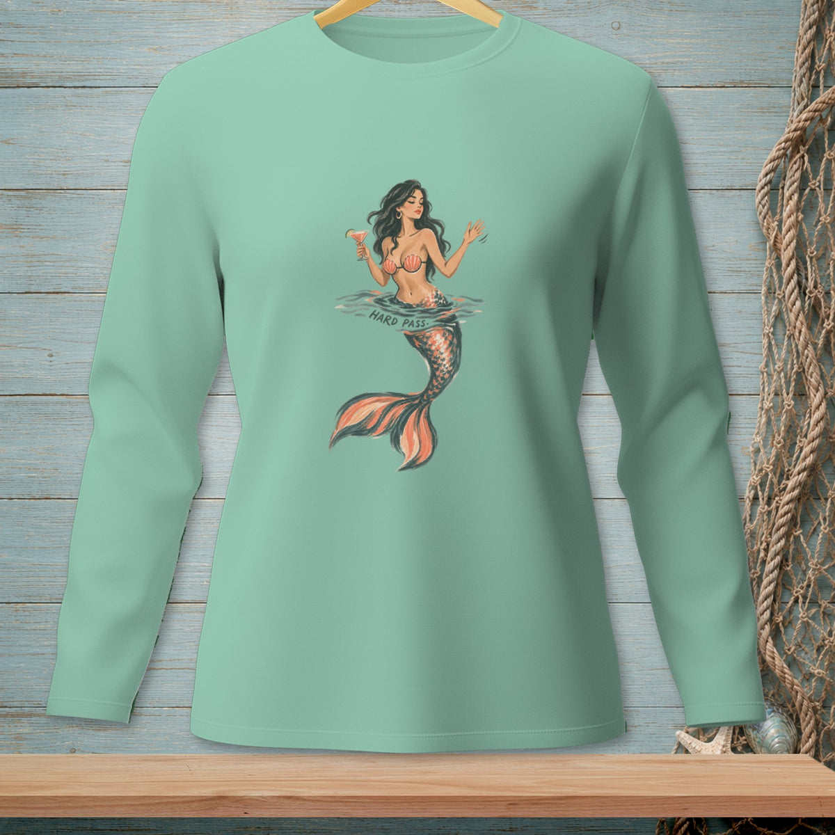 Mermaid holding a cocktail with text "HARD PASS" on a mint long-sleeve shirt.