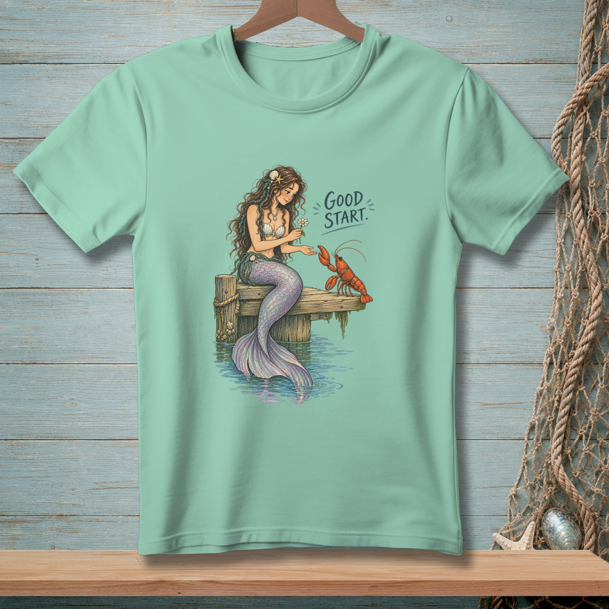 Mermaid with flower and lobster on dock, text reads "GOOD START."