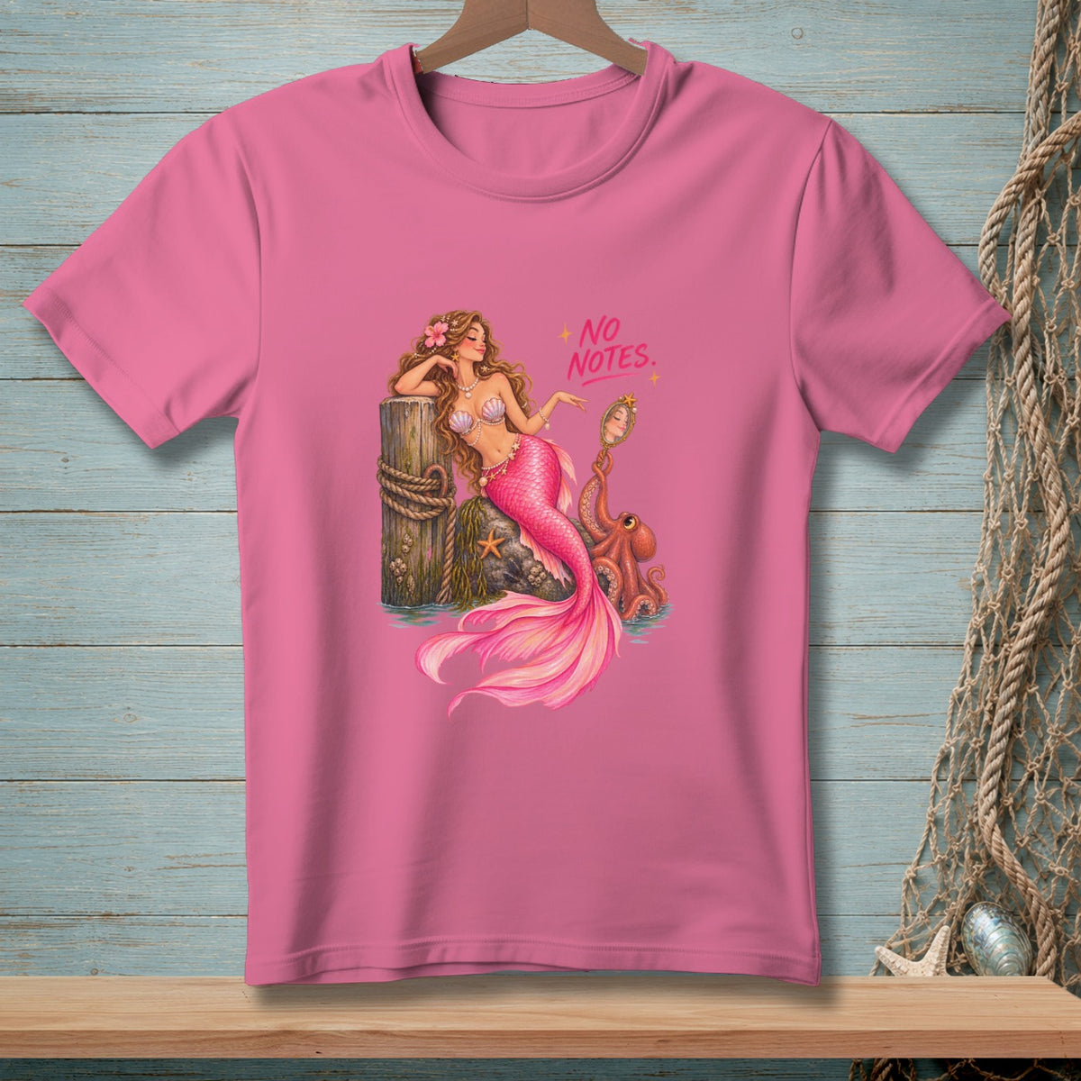 Pink t-shirt with illustration of mermaid, octopus, and "NO NOTES" text.