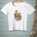 White t-shirt with a mermaid, crabs, and starfish illustration on a rock in the sea.