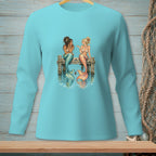 Two mermaids with colorful tails sit on a pier, chatting by the water.
