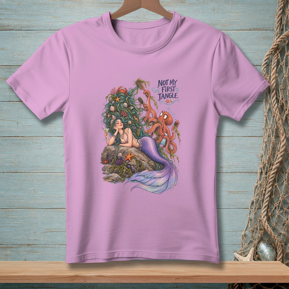Mermaid with octopus and text "NOT MY FIRST JANGLE" on a purple t-shirt.