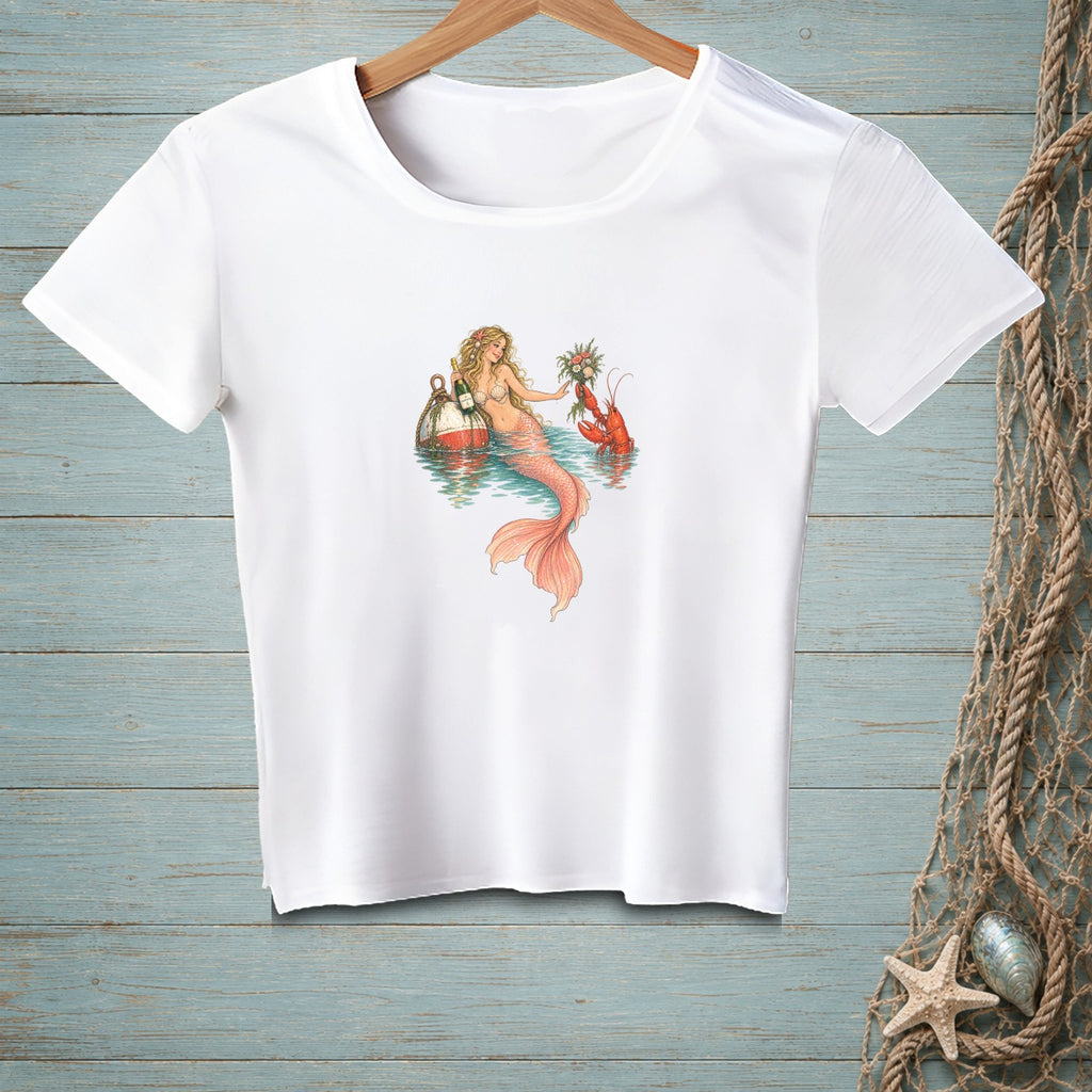White t-shirt with a mermaid, lobster, buoys, and flowers illustration.