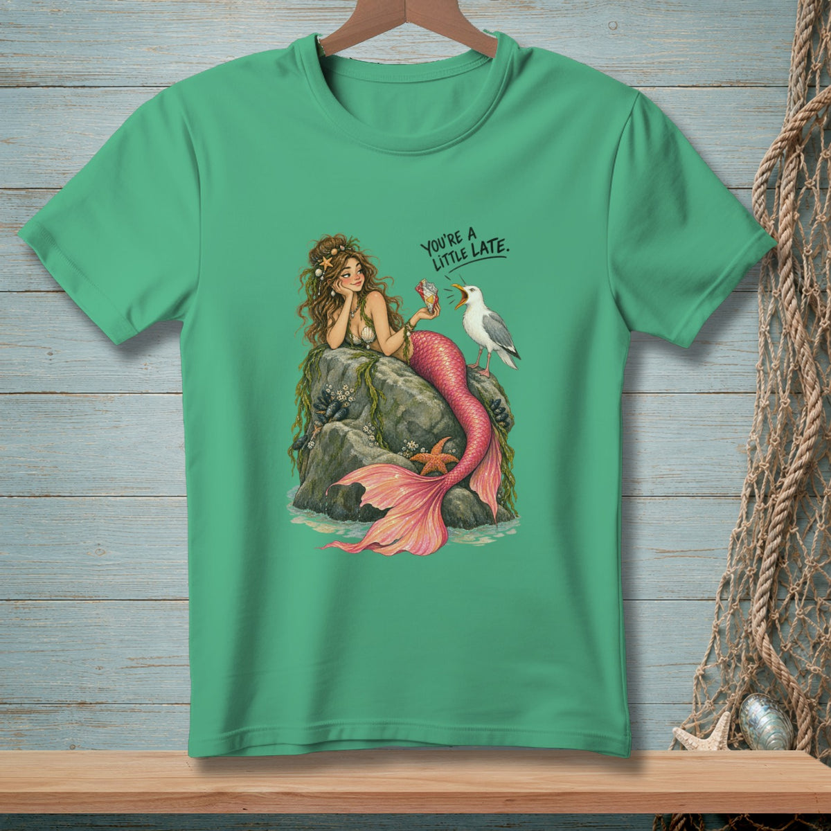 Mermaid on rocks with seagull and text "You're a little late."