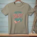 Tan t-shirt with "Resting Beach Face" text, mermaid tail, and sunglasses graphic.