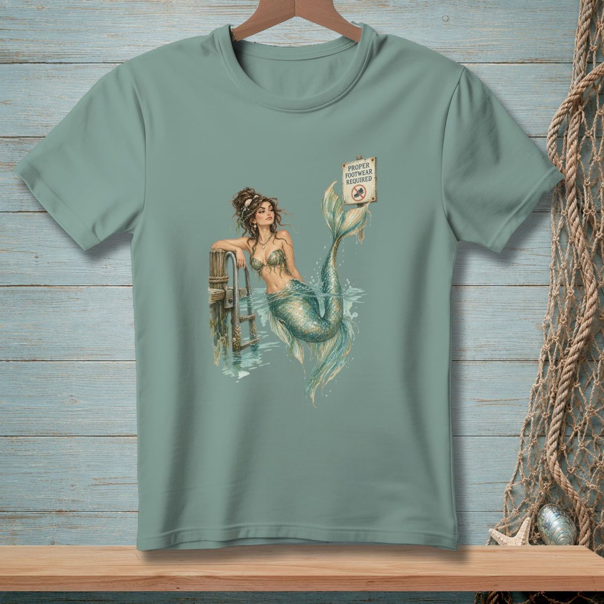 Mermaid by a pier with a "Proper Footwear Required" sign.