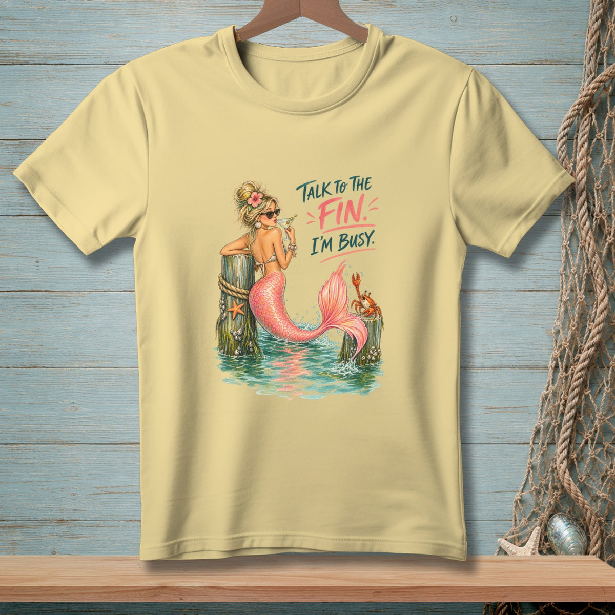 Yellow t-shirt with mermaid graphic and text "Talk to the Fin. I'm Busy."