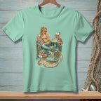 Mint t-shirt featuring a mermaid with coffee, a crab, and a basket of fruit.