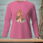 Pink long sleeve shirt with a mermaid and crab graphic on a rock.