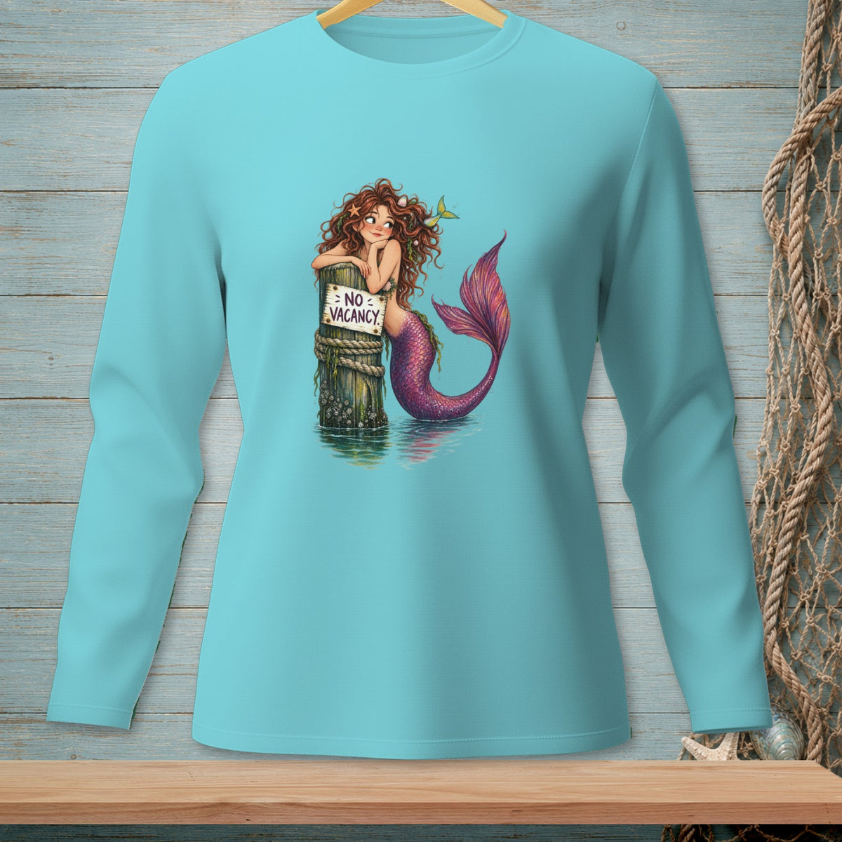 Mermaid leaning on a post with a "No Vacancy" sign in the water.