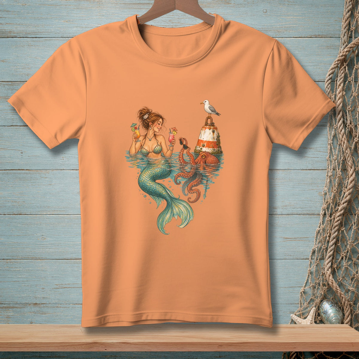 T-shirt with mermaid, octopus, buoy, seagull, and cocktails illustration.