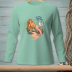 Mint green long-sleeve shirt with a mermaid and seagull graphic saying "I'm not available for this."
