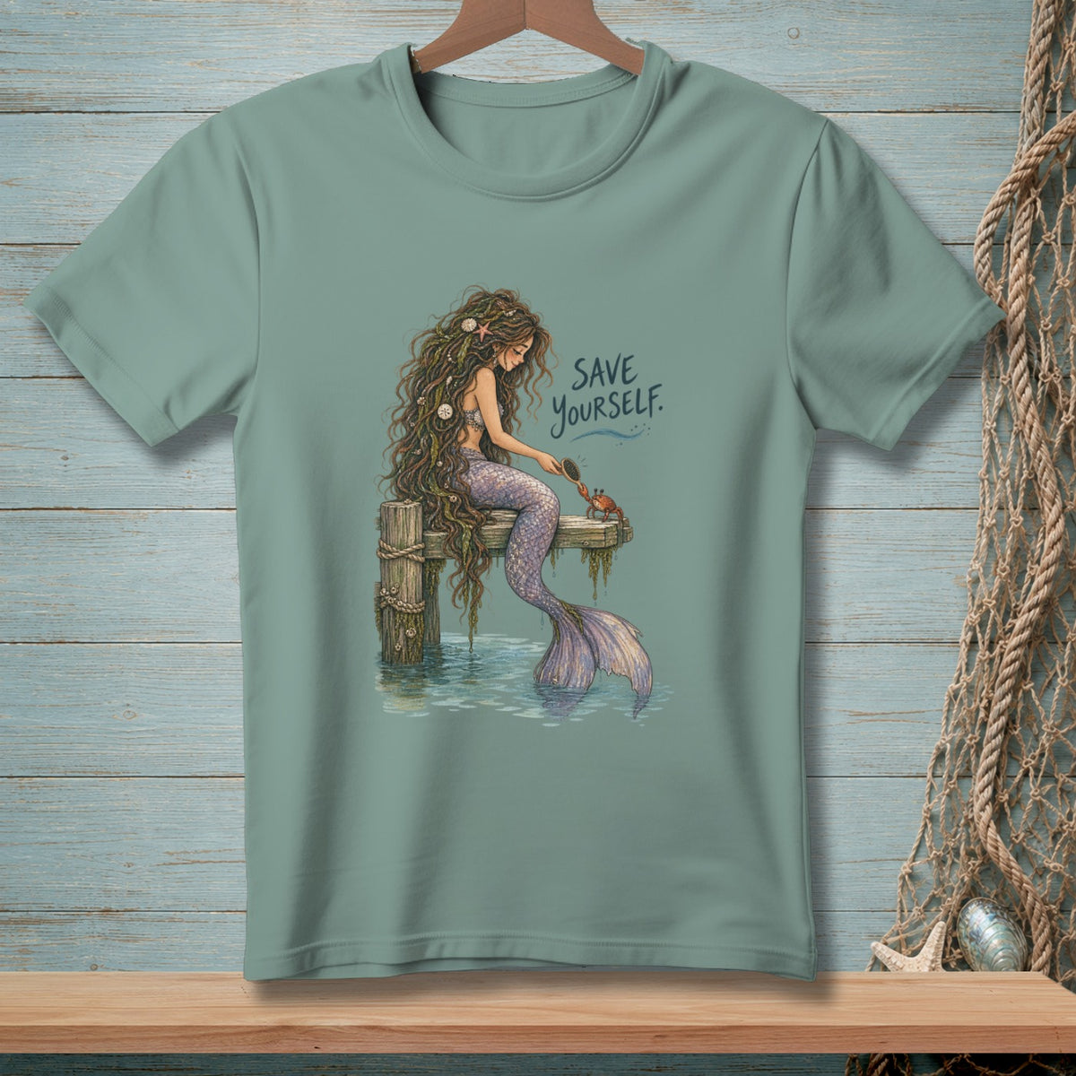 Mermaid with long hair and purple tail sitting on a dock, brushing a crab. "Save Yourself" text.