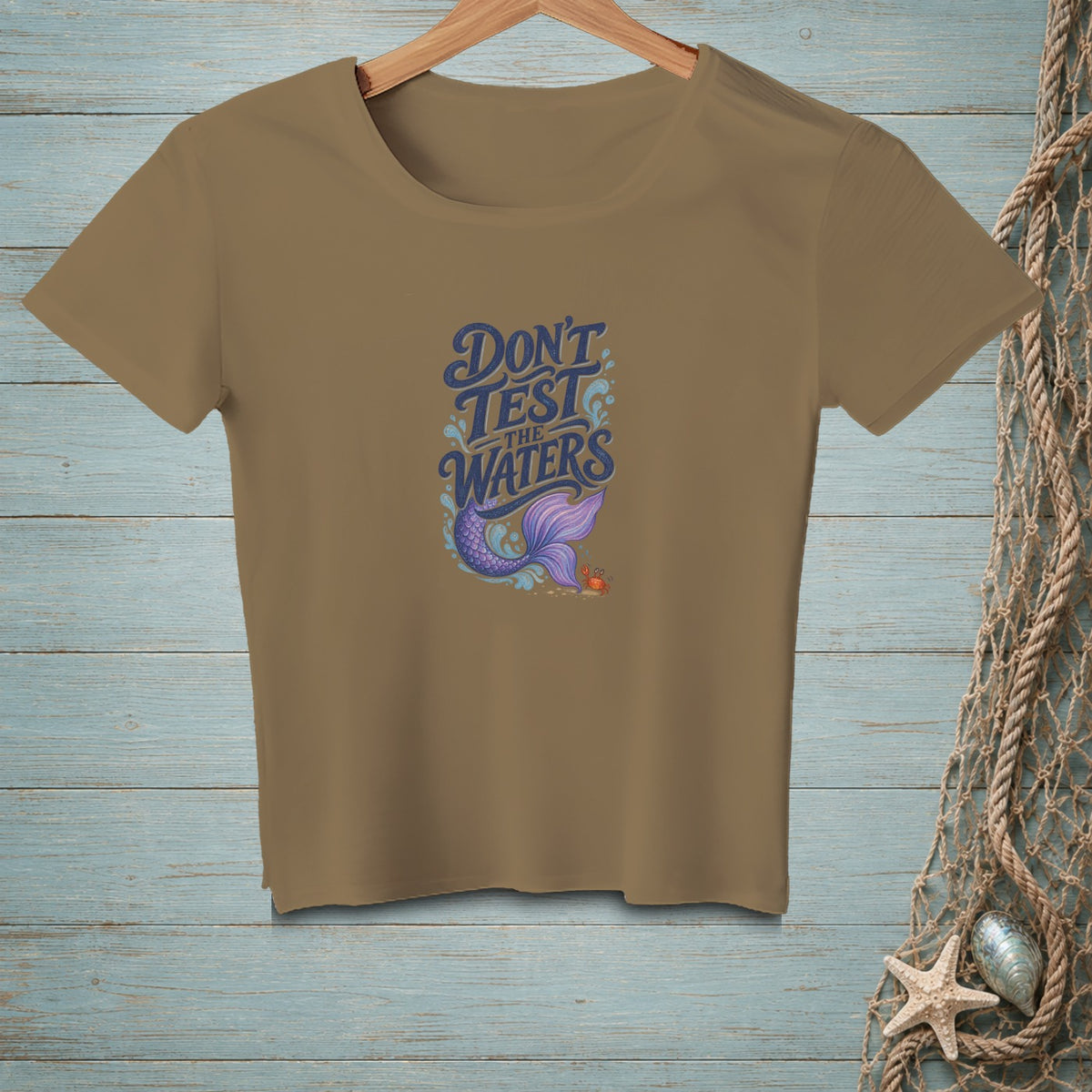 Tan t-shirt with mermaid tail graphic and text "Don't Test the Waters".