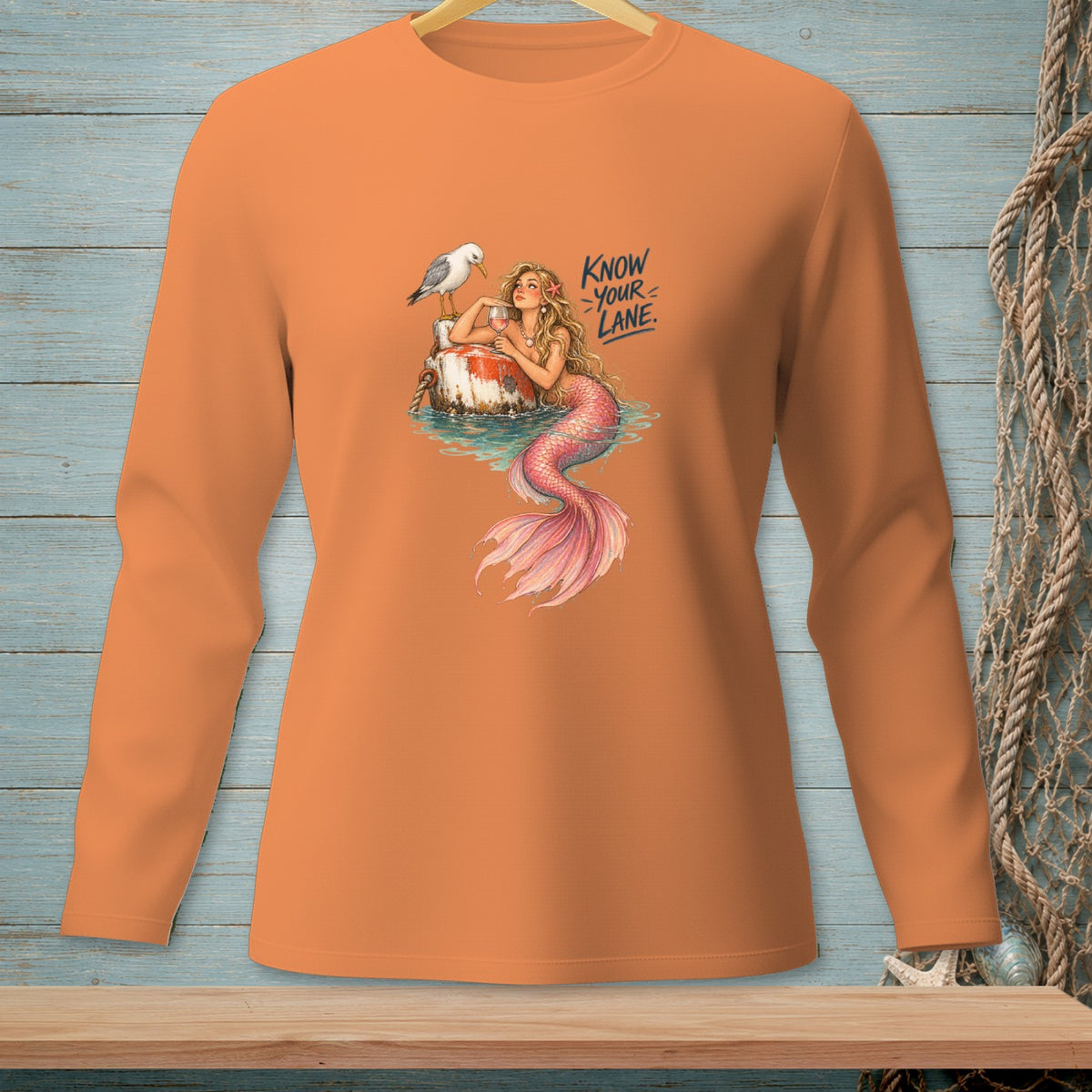Orange long-sleeve shirt with mermaid graphic and text "Know Your Lane".
