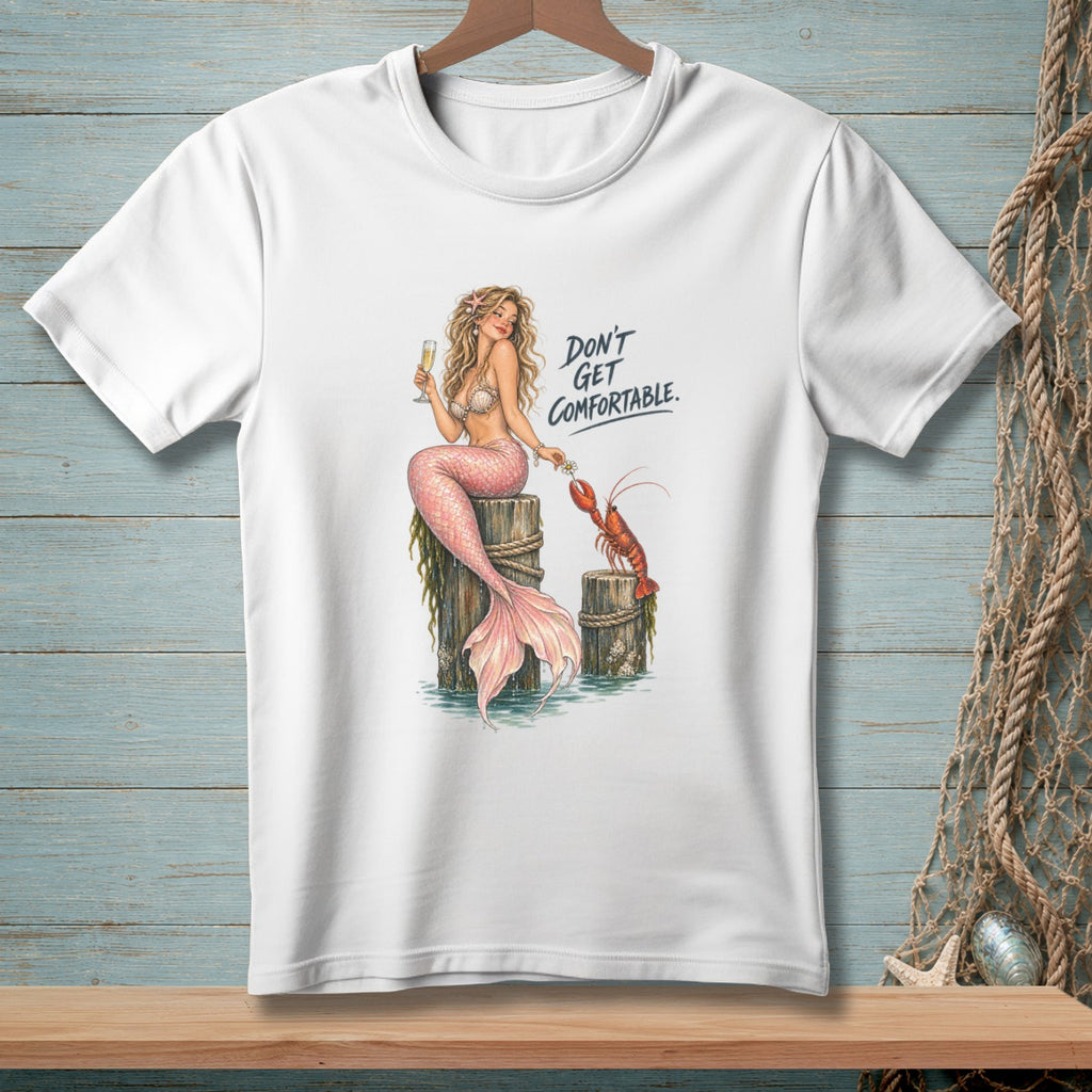 White t-shirt with mermaid and lobster graphic and text "Don't Get Comfortable."