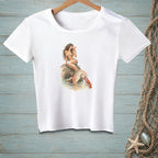 White t-shirt with watercolor art of a mermaid and lobster by the water.