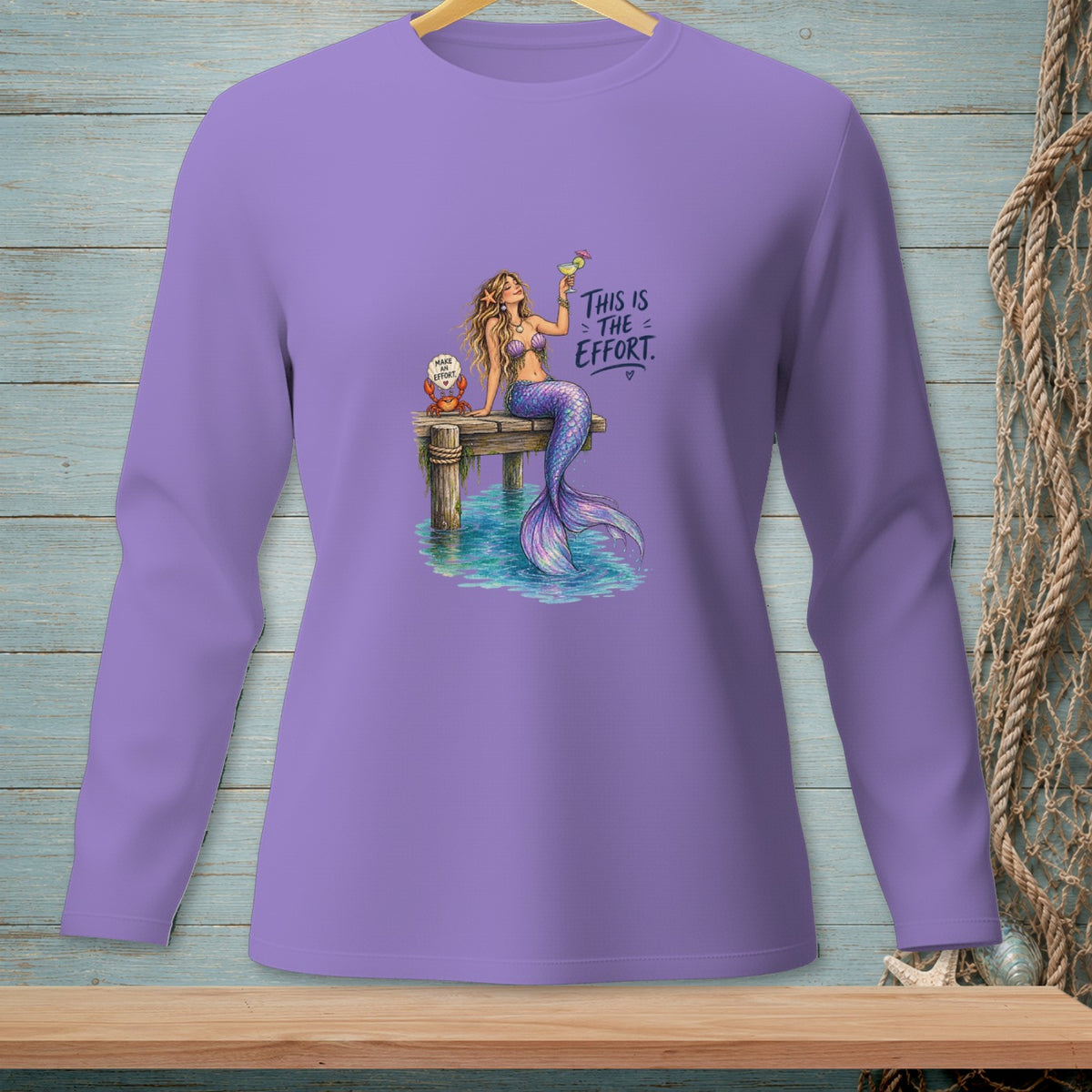 Purple long-sleeve shirt with mermaid and crab graphic that reads "This is the effort."
