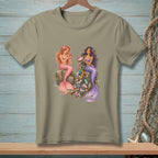 Two mermaids sit on rocks, one with pearls, the other surrounded by trash.