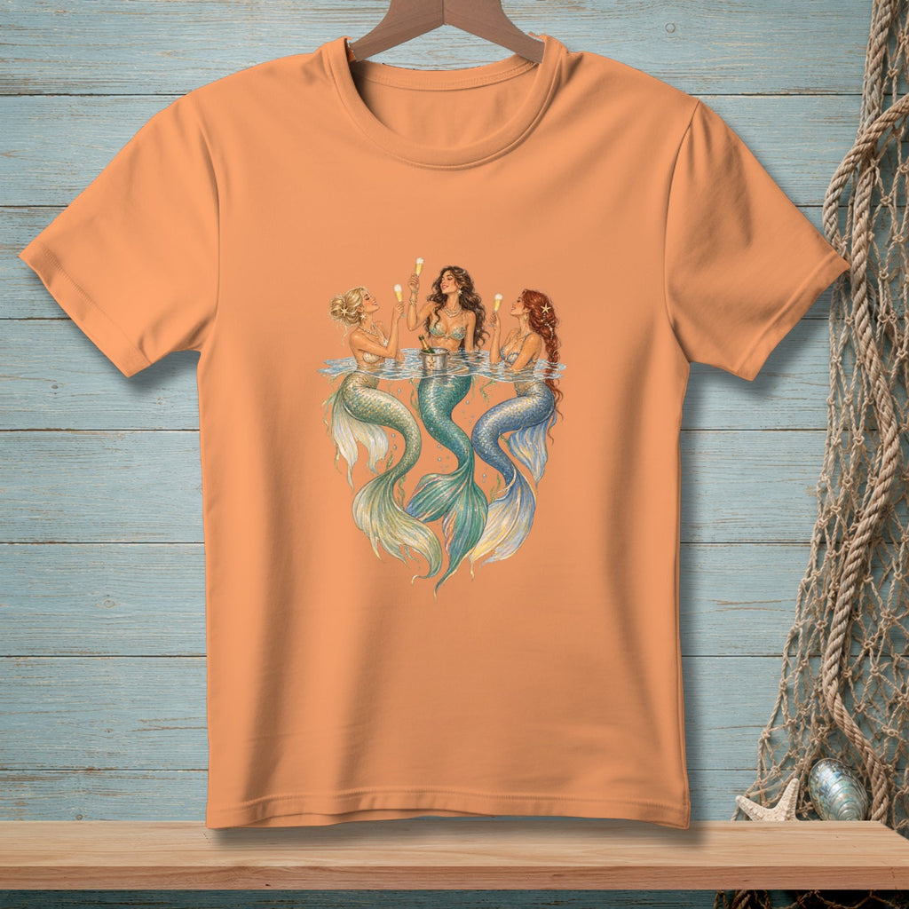 Orange t-shirt with three mermaids holding champagne flutes.