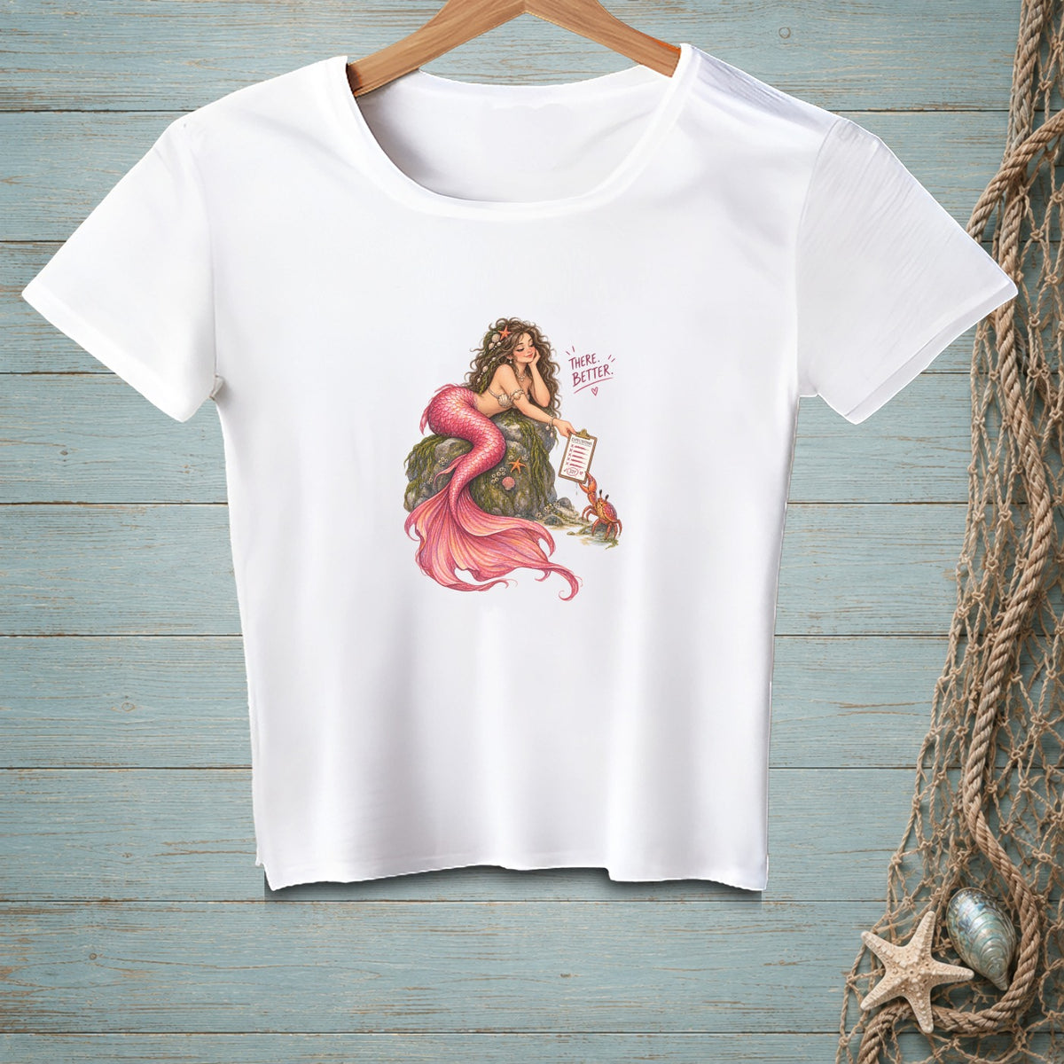 White t-shirt with a mermaid and crab illustration holding a clipboard reading "There, Better".