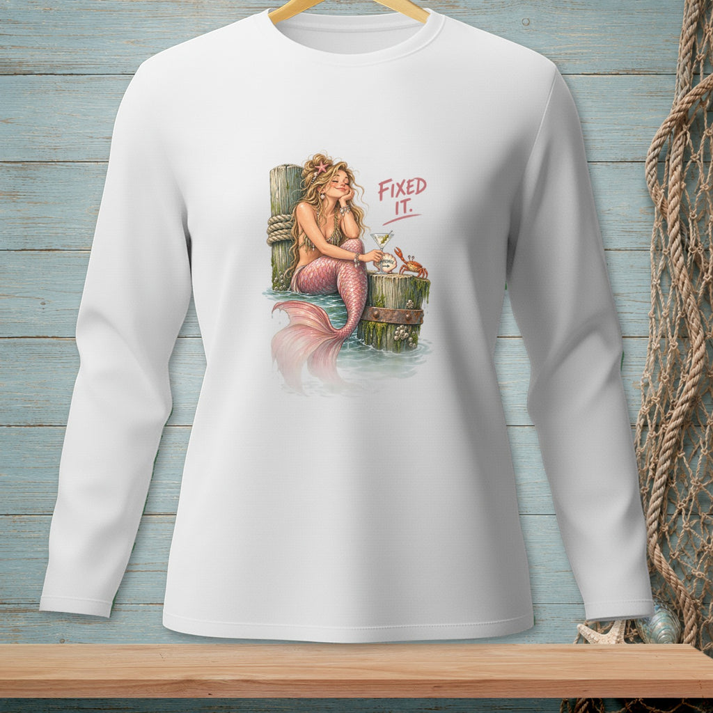 Mermaid with pink tail drinks cocktail on dock, with crab and text "FIXED IT.".