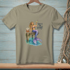 Mermaid on dock with cocktail and crab. Text: "This is the effort."