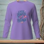 Lavender long-sleeve shirt with "Catch Flights Not Feelings" mermaid tail graphic.