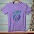 Purple t-shirt with "Mermaid Mode: Do Not Disturb" text and mermaid tail design.