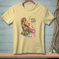 Yellow t-shirt with a mermaid drinking a martini and text that reads "You'll Adjust."
