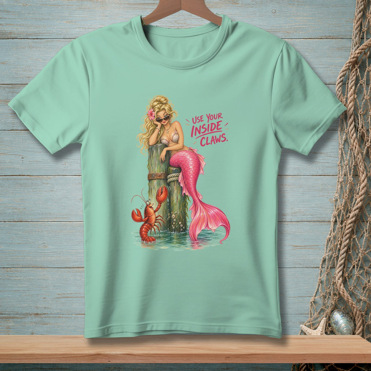Mermaid with lobster and text "USE YOUR INSIDE CLAWS."
