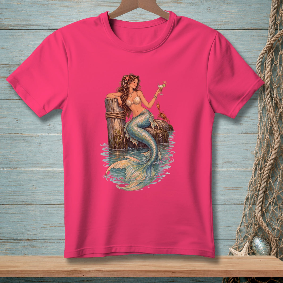 Fuchsia t-shirt with a detailed illustration of a mermaid holding a drink.