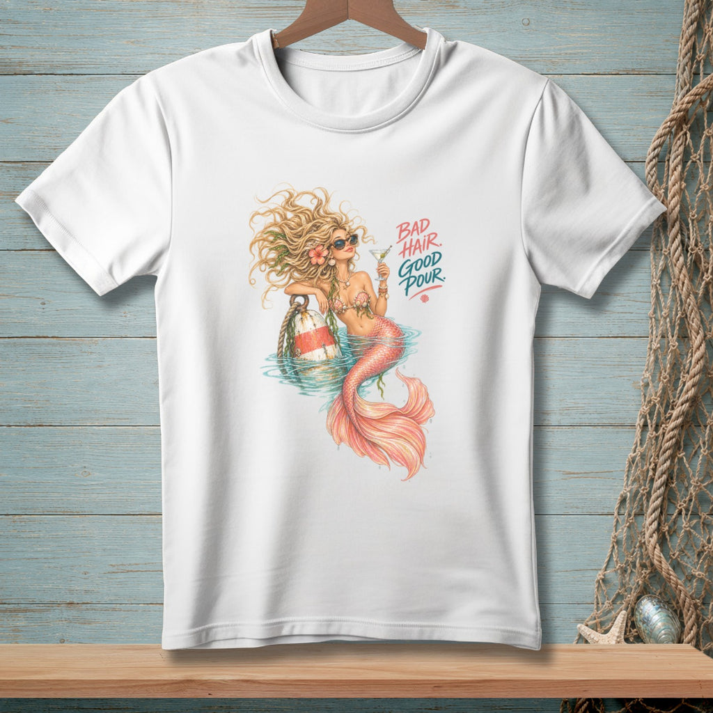 White t-shirt featuring a mermaid with sunglasses and a drink, text reads "BAD HAIR GOOD POUR".