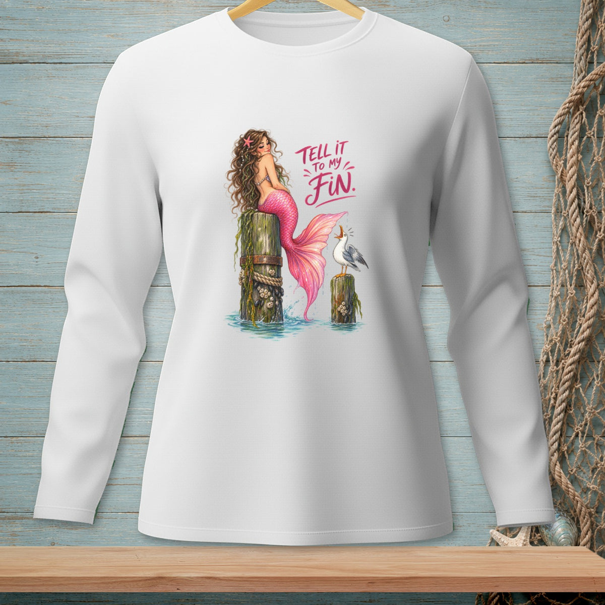 Mermaid with pink tail and seagull on pilings with text "Tell it to my Fin."