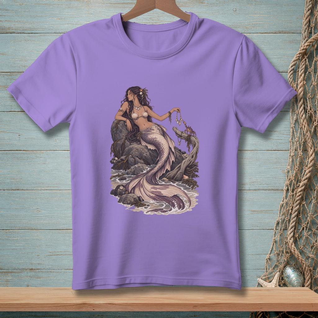 T-shirt with a purple t-shirt featuring a detailed illustration of a mermaid sitting on rocks.