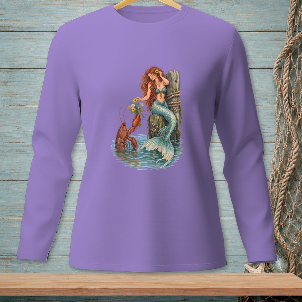 Mermaid with flowers and lobster by a wooden post in water graphic on a purple long-sleeve shirt.