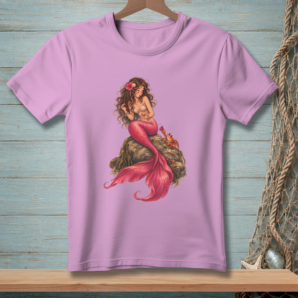 Pink t-shirt with illustration of a mermaid sitting on a rock with a crab.