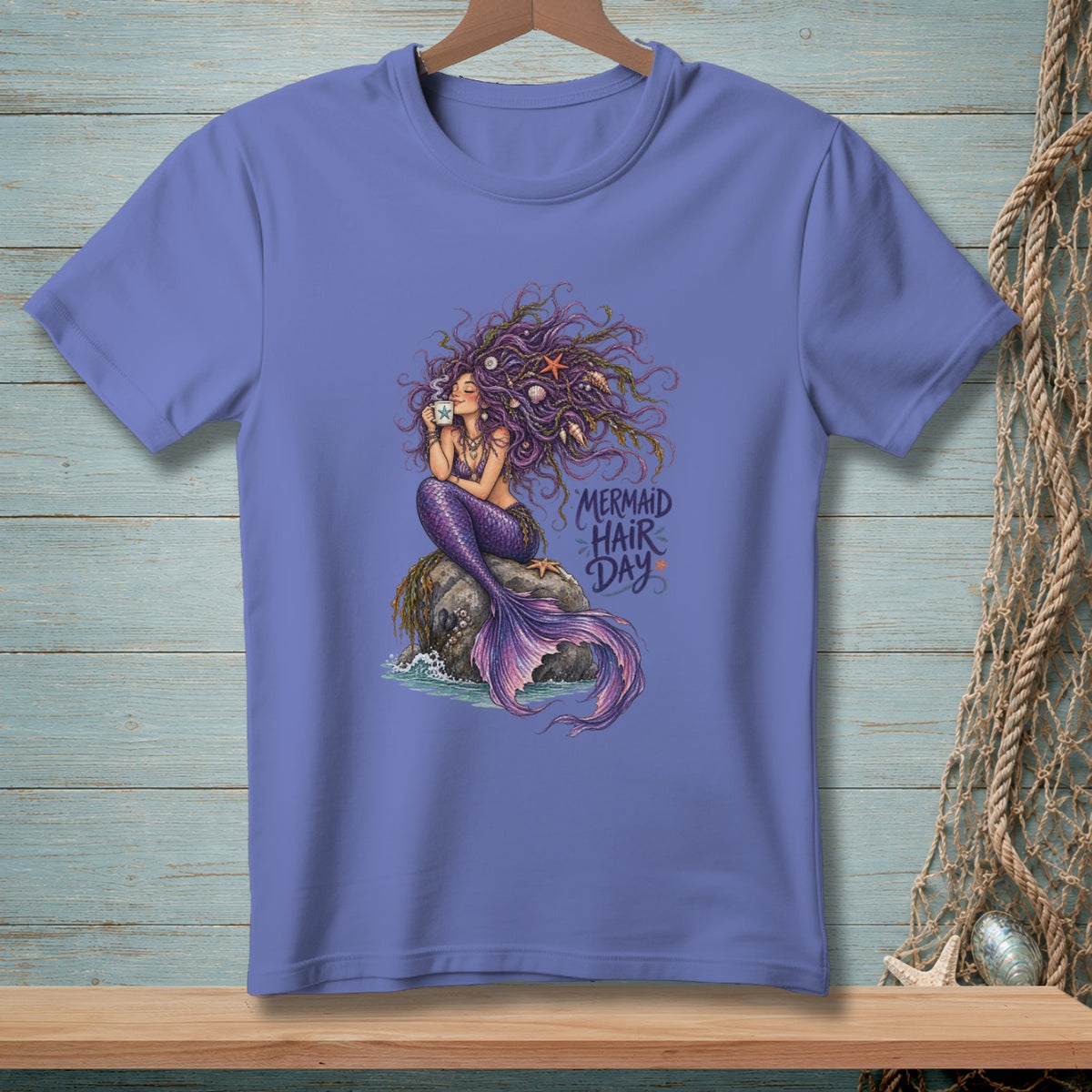 Purple t-shirt with a mermaid holding a coffee cup and the text "Mermaid Hair Day".