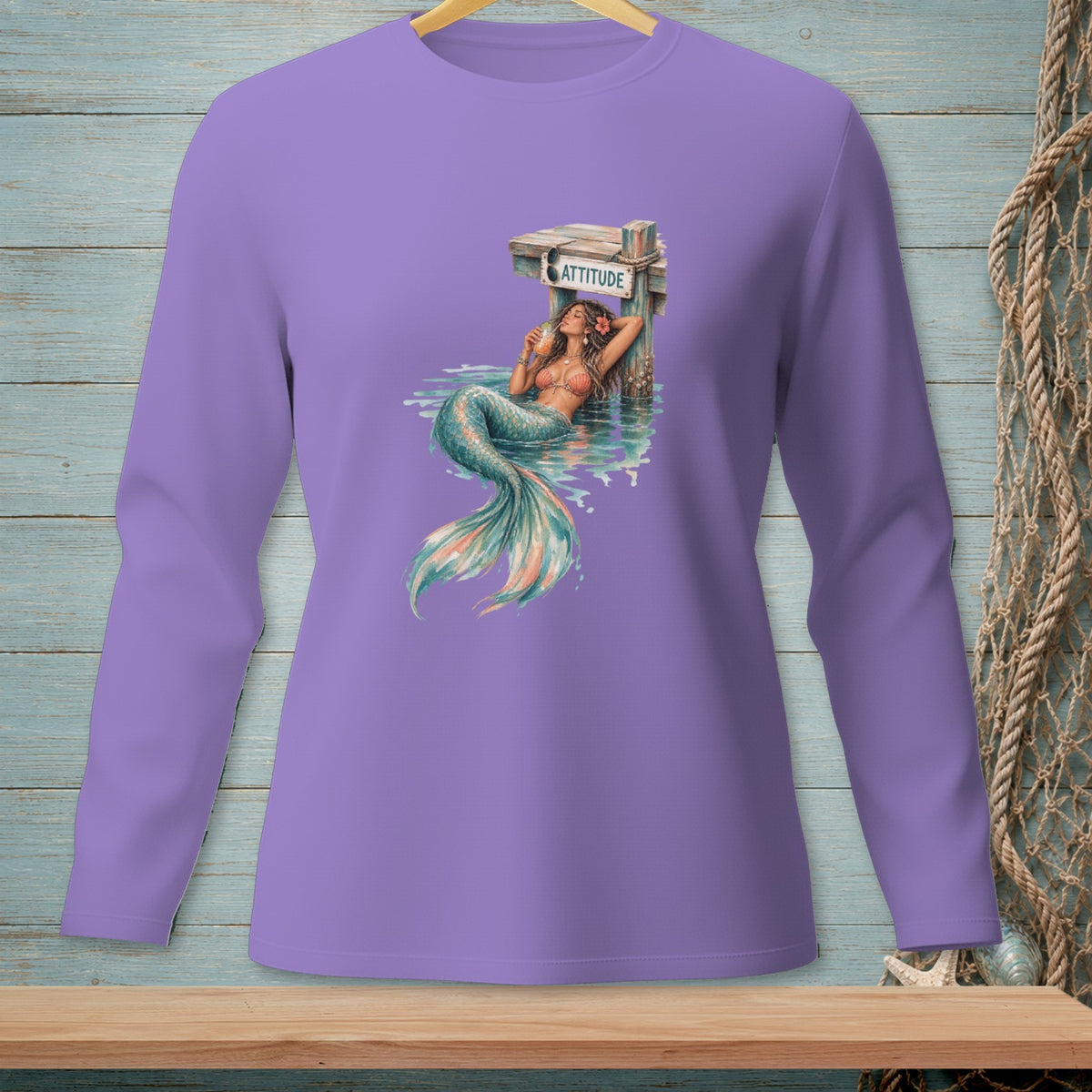 Purple long-sleeved shirt with a mermaid graphic and the word "ATTITUDE".