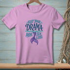 Pink t-shirt with "Keep your drama above sea level" and mermaid tail graphic.