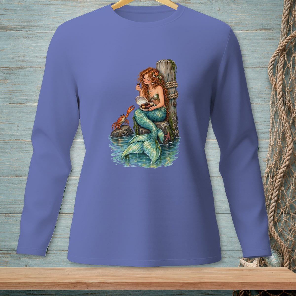 Illustration of a mermaid holding a seashell full of chocolates with a crab nearby.