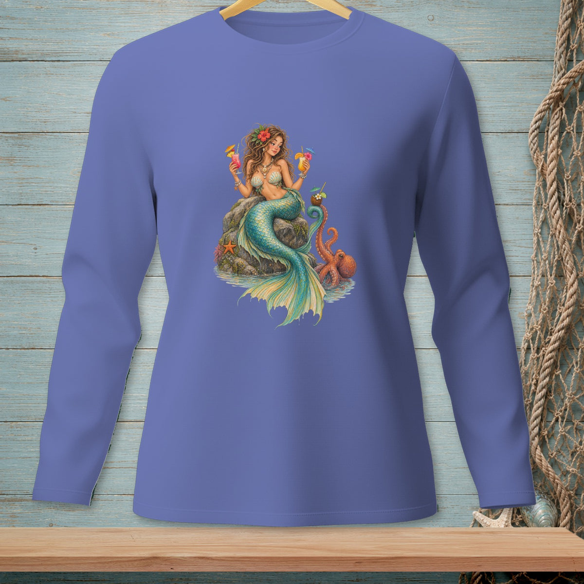 Mermaid holding cocktails with octopus on a rock, printed on a purple long-sleeve shirt.