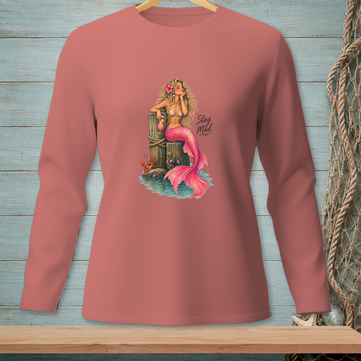 Pink mermaid with a drink and crab, text "Stay Mad".
